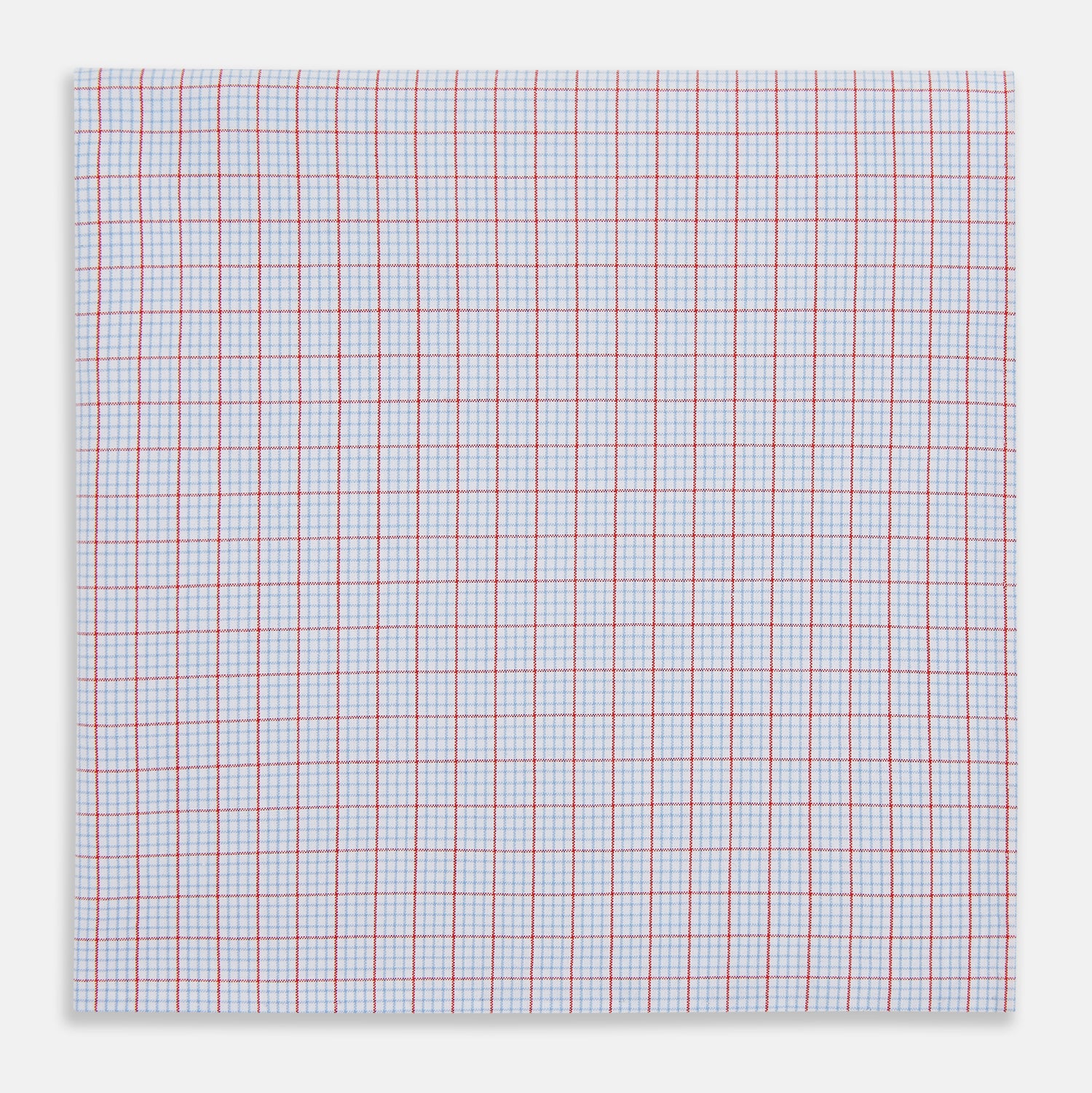 View 1 of product The Turnbull & Asser Hand Rolled Red Multi Graph Check Handkerchief features blue and red grid lines on white, with a red check forming larger squares and blue lines creating smaller squares within the design.