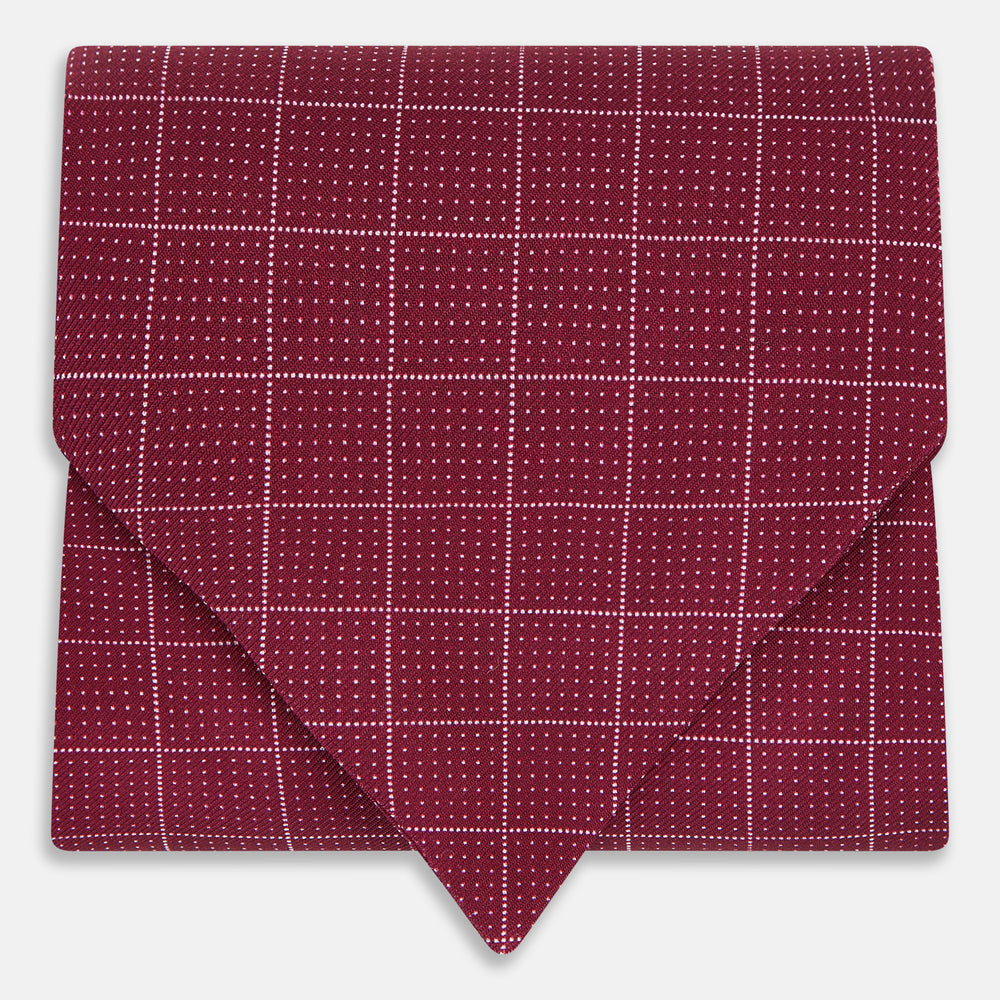 The Turnbull & Asser Burgundy Dotted Check Pattern Printed Silk Cravat, shown on a white background, features a refined British design perfect for elevating your look.