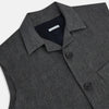 View 2 of product The Turnbull & Asser Ash Collared Linen Waistcoat is a sleeveless dark gray piece with a button-down front, two zippered side pockets, and a small chest pocket, shown against a plain white background.