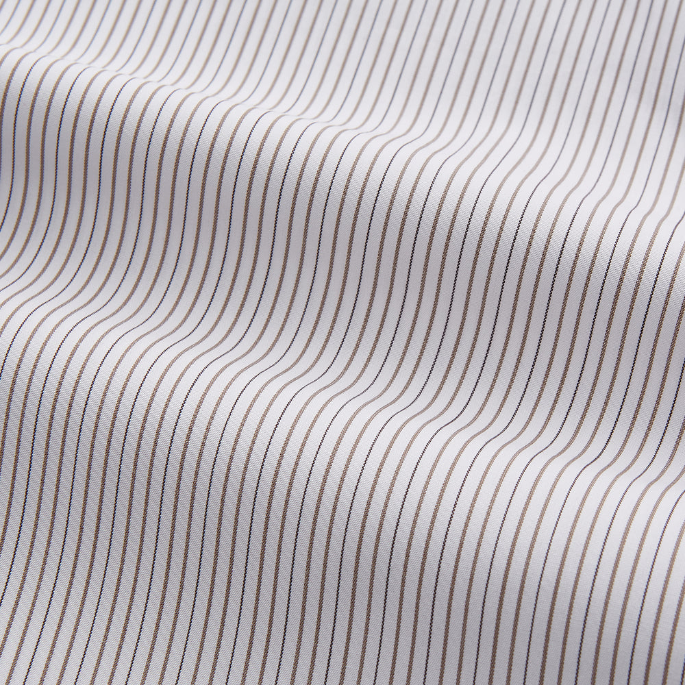 The Turnbull & Asser Sandstone Multi Stripe Cotton Regular Fit Mayfair Shirt, featuring long sleeves, button-up front, chest pocket, and classic collar with subtle white and light gray vertical pinstripes, is laid flat on a white background.