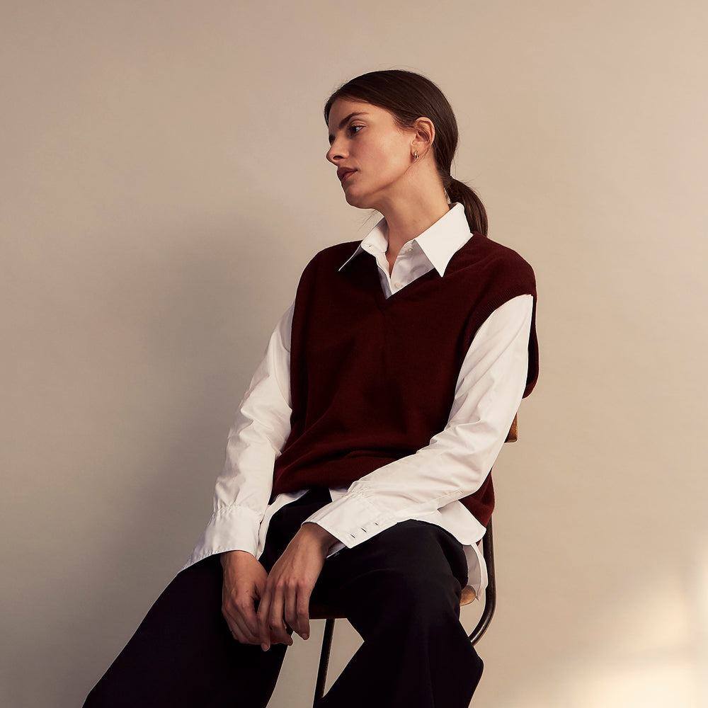 The White Cotton Tailored Bianca Shirt by Turnbull & Asser features a pointed collar and button cuffs, crafted from soft organic cotton and displayed flat on a white background for timeless elegance.