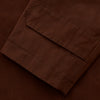 View 5 of product The Burgundy Grayson Car Coat by Turnbull & Asser, made from a rain-resistant cotton blend with a collar, hidden front buttons, and slanted pockets, is displayed flat on a white background in a minimalist style.