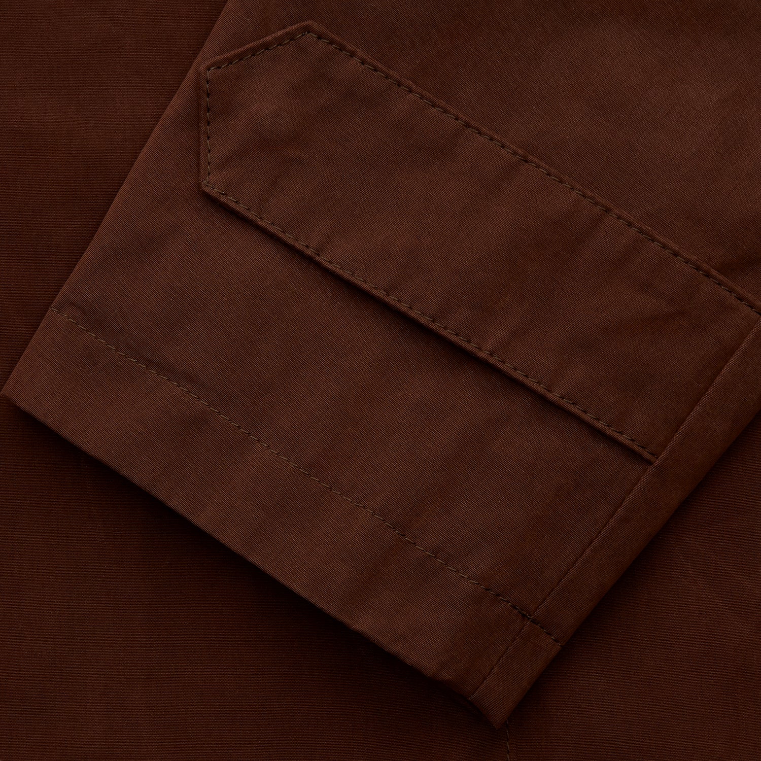 View 5 of product The Burgundy Grayson Car Coat by Turnbull & Asser, made from a rain-resistant cotton blend with a collar, hidden front buttons, and slanted pockets, is displayed flat on a white background in a minimalist style.