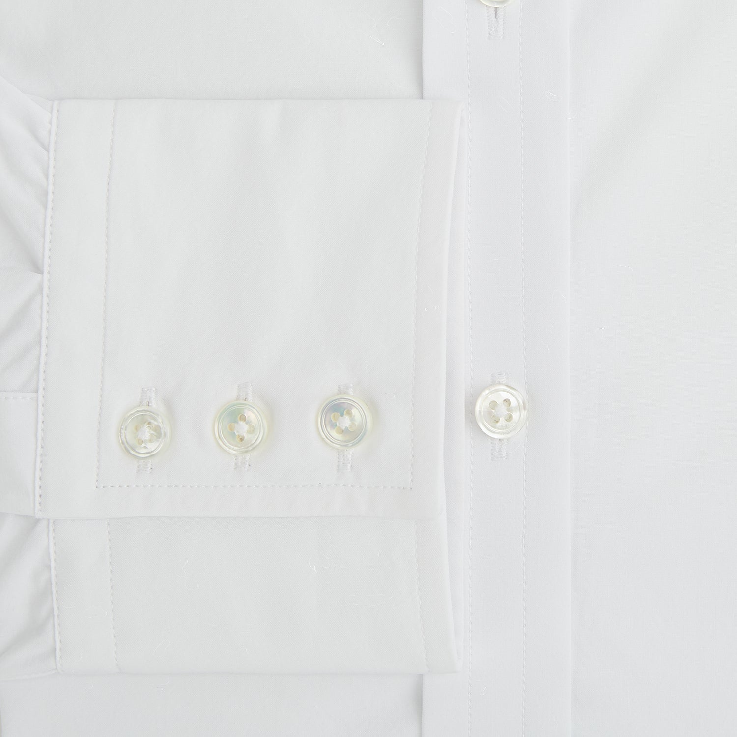 View 4 of product The White Mayfair Shirt by Turnbull & Asser features a classic collar, white buttons, and an inner branded label, all neatly crafted from premium sanforised cotton for lasting quality.