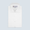View 1 of product The Turnbull & Asser Tailored Fit Two-Fold 120 White Cotton Shirt features a Kent collar, double cuffs, and button-down front, displayed neatly folded against a light blue background.