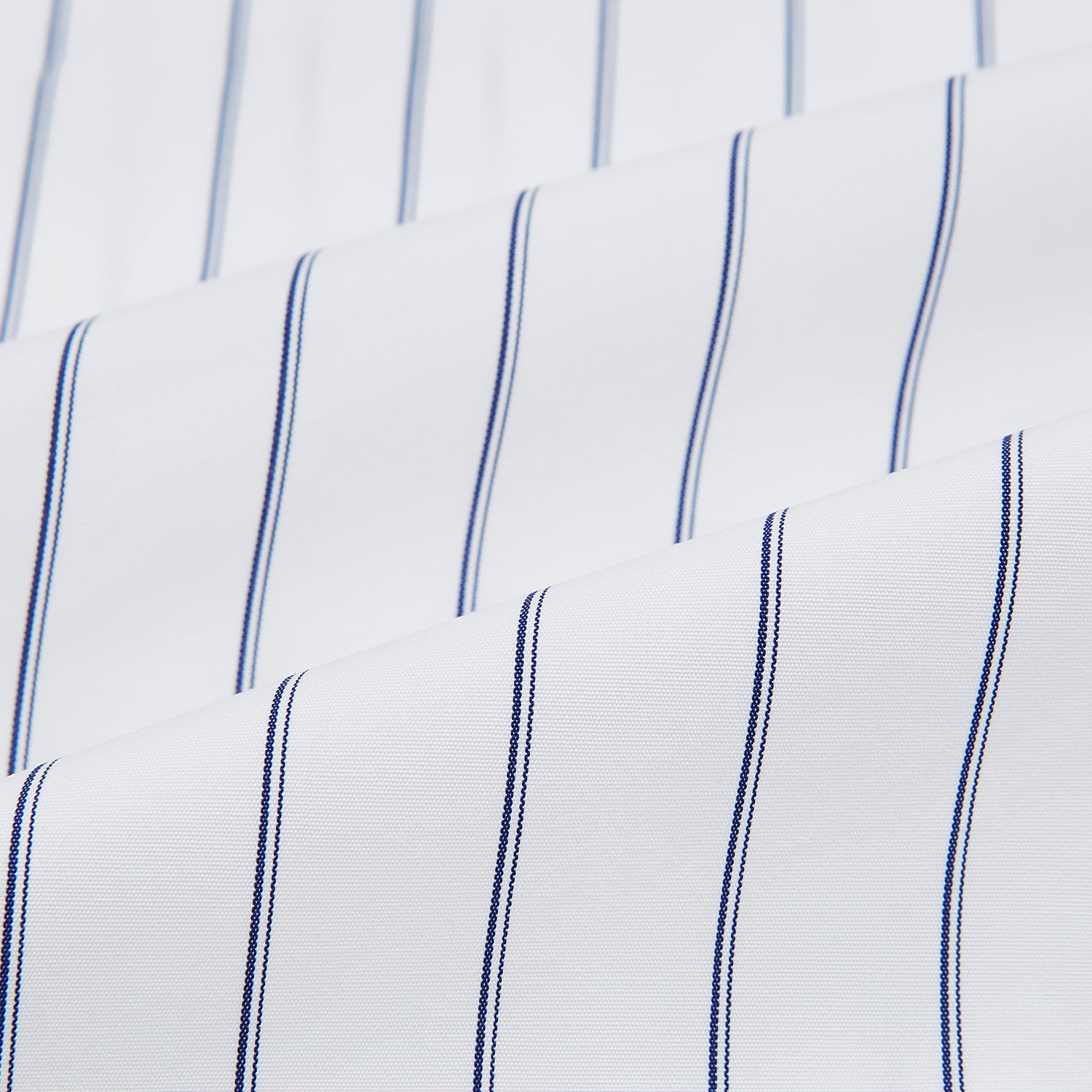 View 8 of product The Dark Navy Double-Pinstripe Westminster Shirt by Turnbull & Asser, featuring a Turnbull collar and cuffed sleeves, is displayed laid flat on a plain white background, highlighting its British craftsmanship.