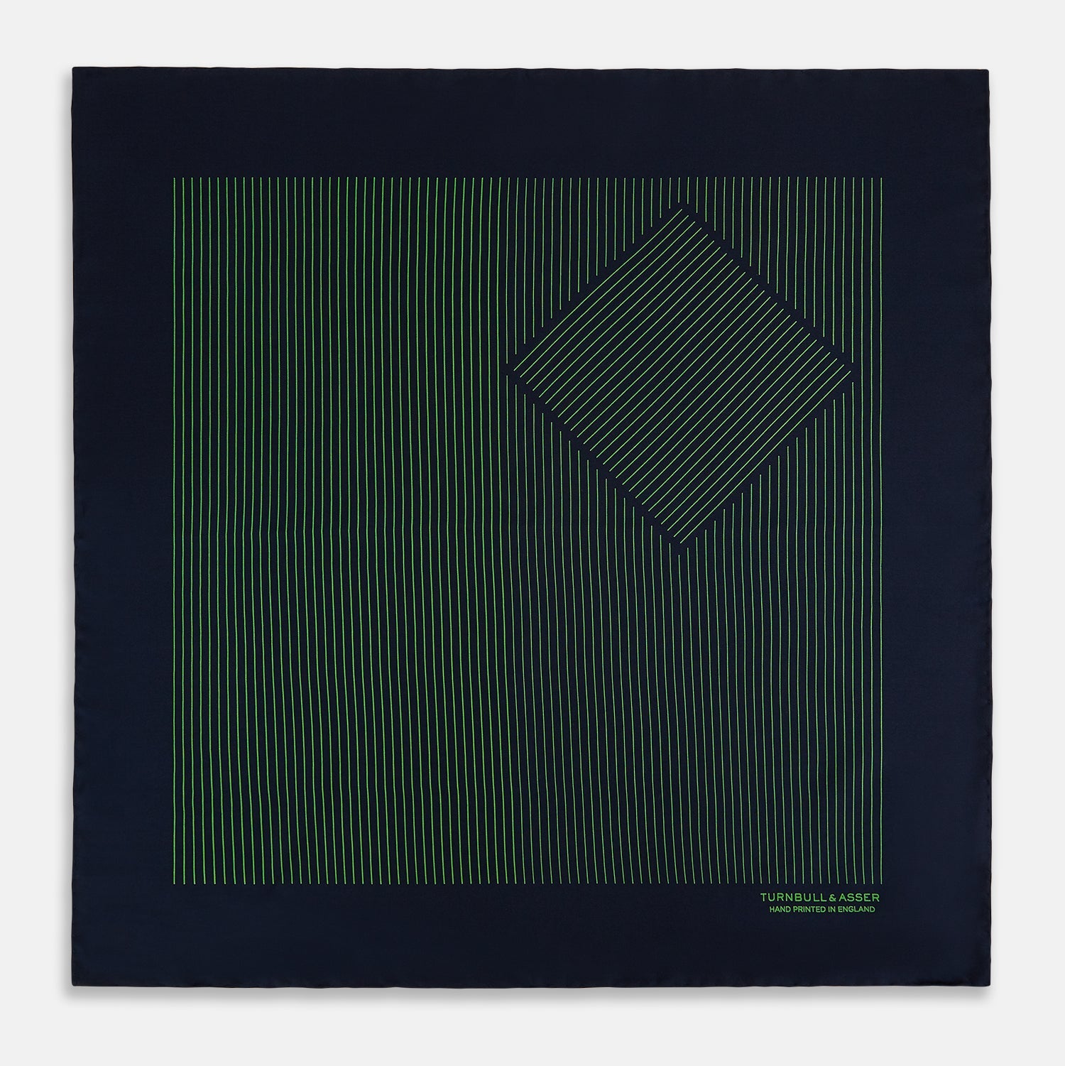 View 3 of product The Navy and Fern Green Stripe Silk Pocket Square by Turnbull & Asser features green vertical and diagonal stripes, hand-rolled edges, and "TURNBULL & ASSER HAND PRINTED IN ENGLAND" printed in one corner.