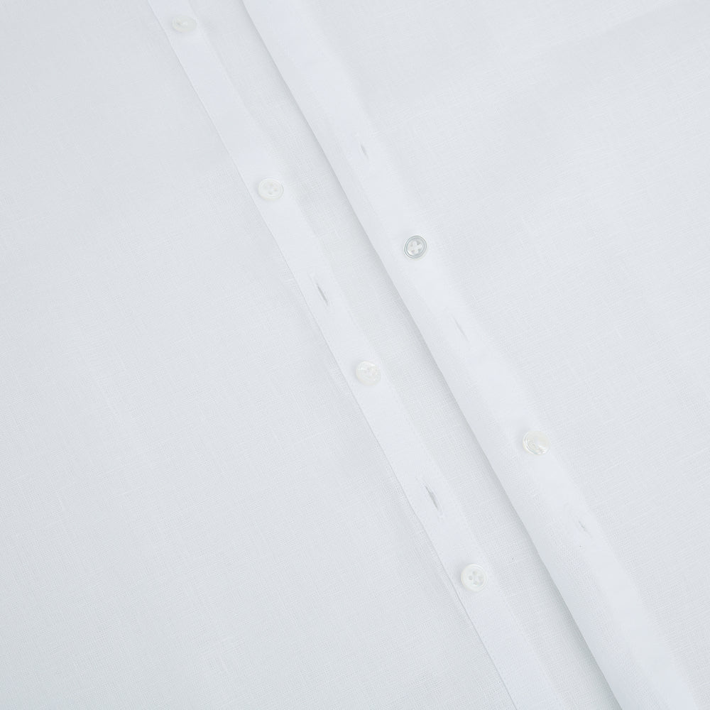 The White Linen Westminster Shirt by Turnbull & Asser features a classic Turnbull collar and button-down front, highlighting British craftsmanship against a plain white background.