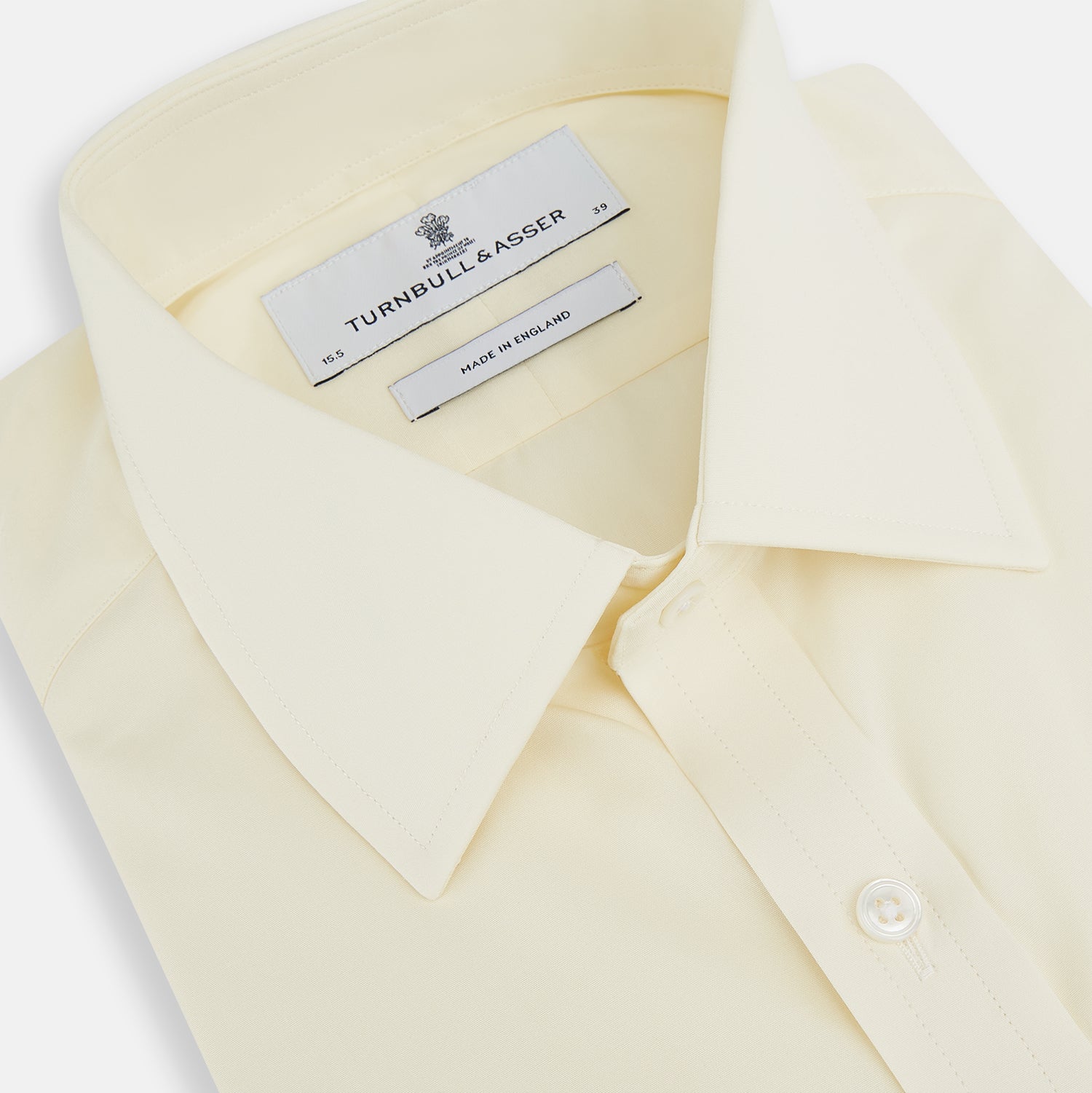 View 2 of product The Turnbull & Asser Cream Cotton Shirt features a T&A collar and double cuffs, elevating men's style. Displayed flat against a white background, this long-sleeve shirt is crafted in classic cream cotton.