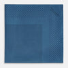 View 3 of product The Blue Dot Silk Pocket Square by Turnbull & Asser features small black polka dots on blue silk and is made in England. The image shows it neatly folded, with a corner turned down to display both sides.