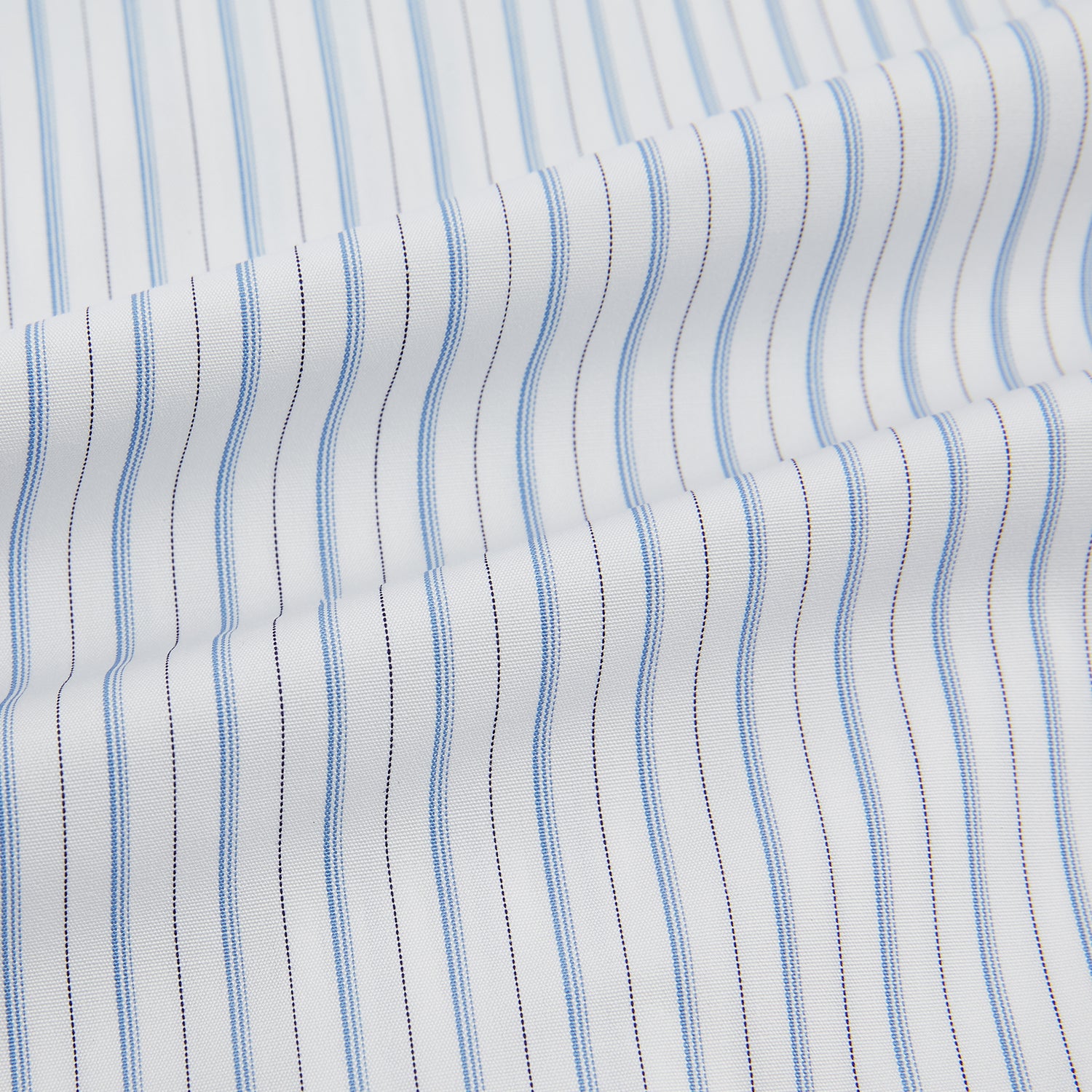View 6 of product The Turnbull & Asser Sky Blue Combination Stripe Mayfair Shirt features long sleeves, a T&A collar, buttoned cuffs, and thin vertical stripes in blue, shown on a plain white background.
