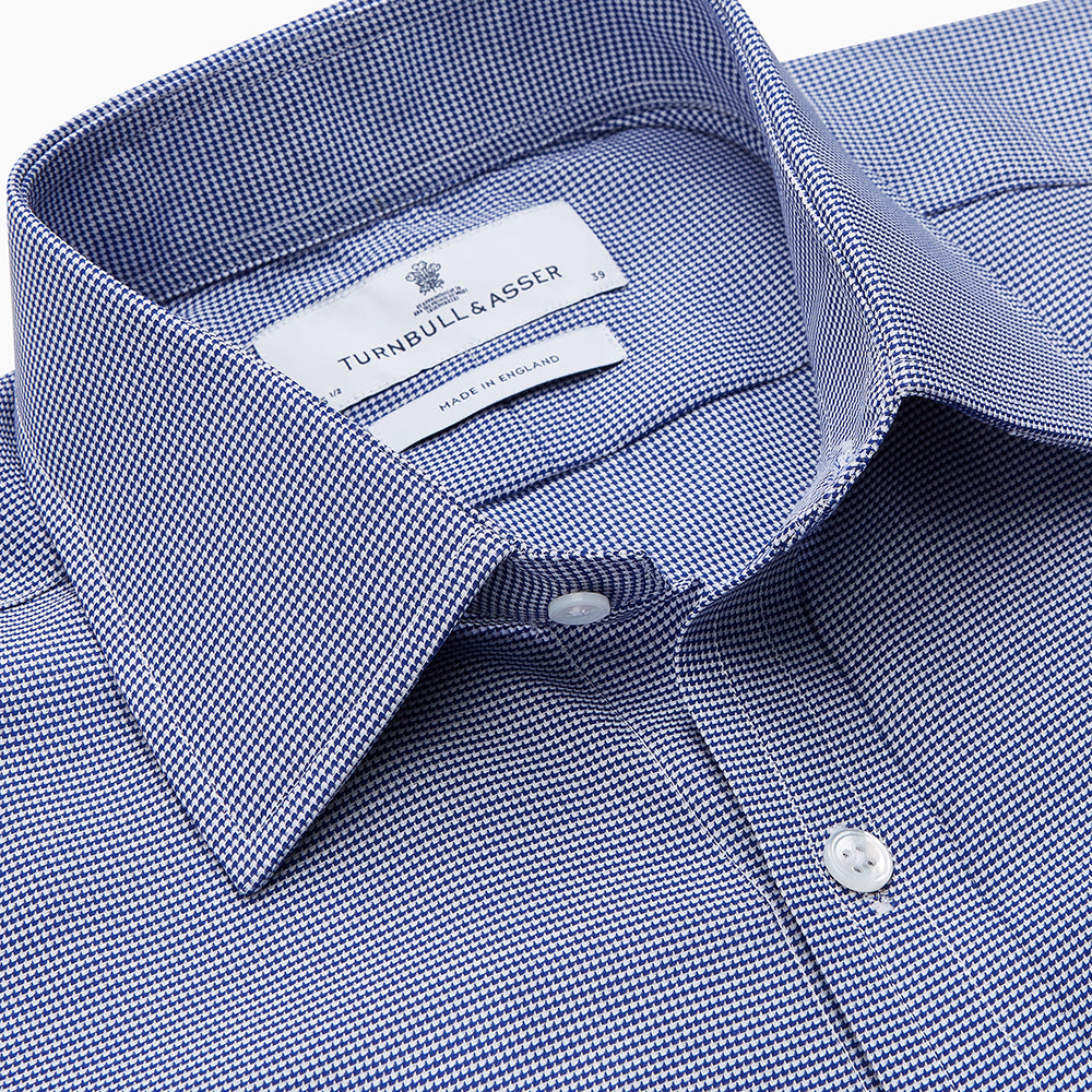 A navy pattern cotton voile regular fit Mayfair shirt by Turnbull & Asser, featuring long sleeves, a button-up front, classic collar, and white buttons, displayed flat against a white background.