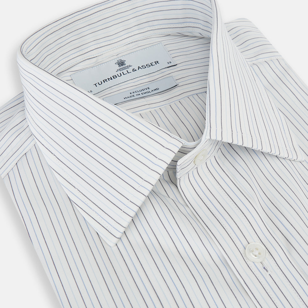 The Turnbull & Asser Blue Multi-Tone Double Pinstripe Mayfair Shirt, crafted from premium Italian cotton with a pointed collar, buttoned cuffs, and long sleeves, is shown on a plain white background.