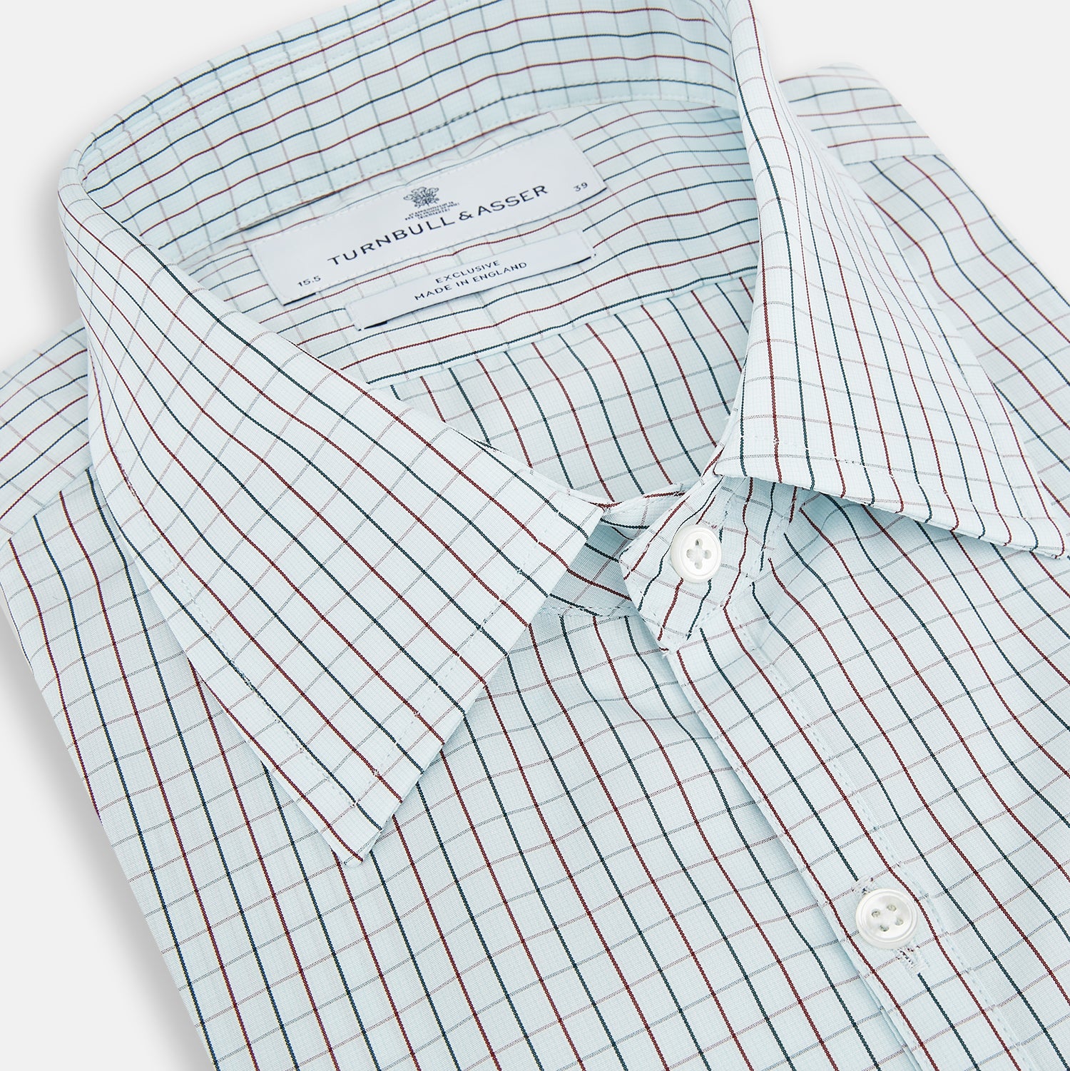 View 2 of product The Turnbull & Asser Forest Melange and Red Overlay Grid Check Westminster Shirt features long sleeves, a pointed collar, and buttoned cuffs, highlighting British craftsmanship. It's shown laid flat against a white background.