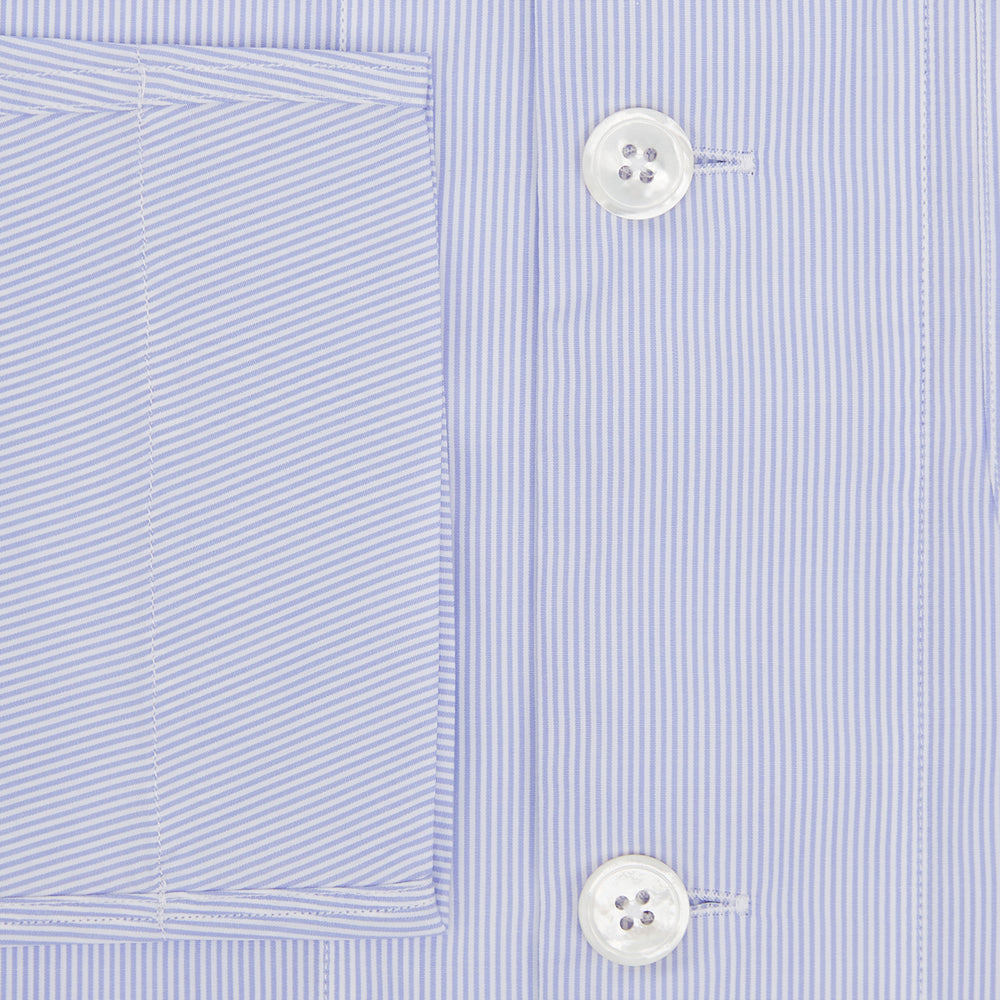 The Turnbull & Asser Pale Blue Hairline Stripe Pyjama Shirt features long sleeves and a single chest pocket, offering an elegant sleepwear style—shown on a plain white background.