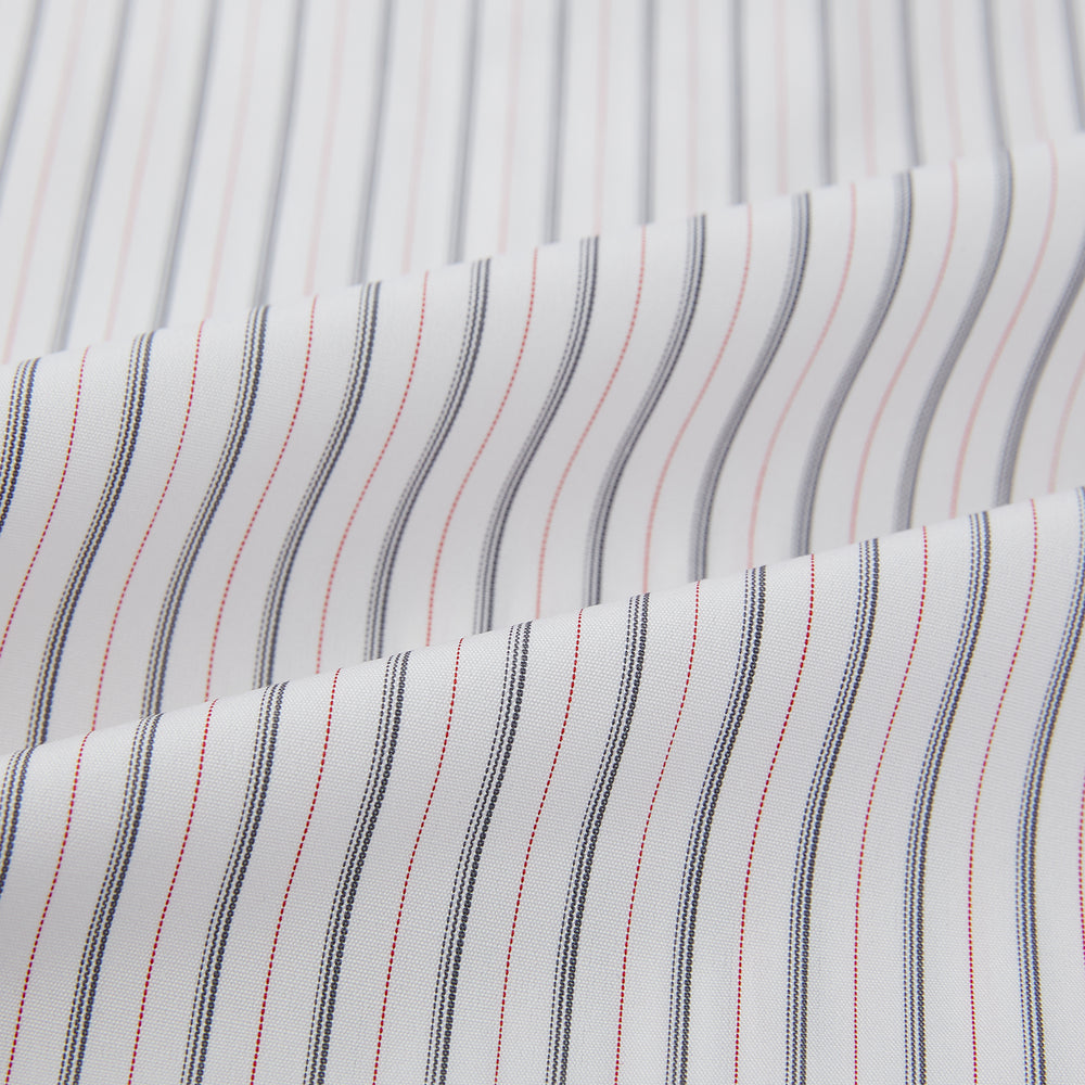 The Turnbull & Asser Midnight Blue and Red Ticking Stripe Mayfair Shirt features long sleeves, a pointed collar, buttoned cuffs, and fine Italian cotton—an essential men's wardrobe piece shown on a plain white background.
