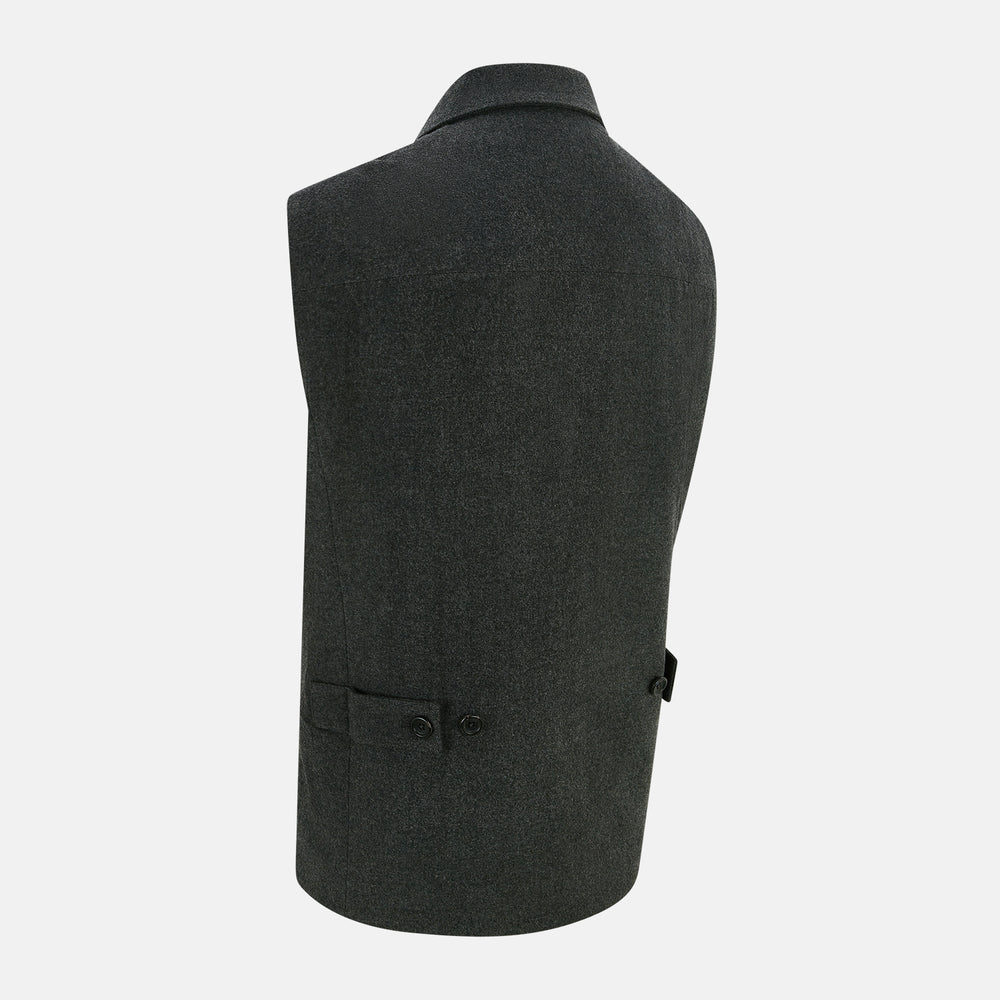 The Graphite Melange Collared Single-breasted Waistcoat by Turnbull & Asser features a dark gray hue, front buttons, collar, two zippered side pockets, and a chest pocket—perfect for winter. Shown on a plain white background.