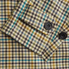 View 3 of product The Turnbull & Asser Green and Blue Multi Check Wool Elliot Coat is a men’s knee-length, long-sleeved overcoat with a collar and button-up front, crafted from Scottish wool in a check plaid pattern, shown on a white background.