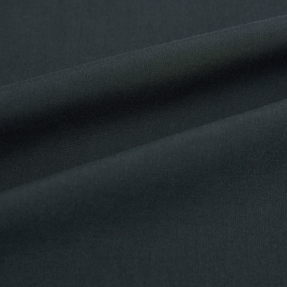 The Charcoal Windsor Shirt by Turnbull & Asser is a black, long-sleeve button-up with a pointed Windsor collar, buttoned cuffs, and a straight hem, shown flat on a white background.