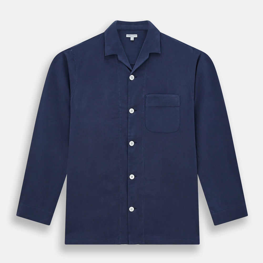 Turnbull & Asser Navy Silk Pyjama Set, laid flat on a white background, includes a long-sleeve button-up shirt with chest pocket and drawstring pants.