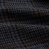 View 4 of product The Turnbull & Asser Charcoal Grey Check Wool Pierce Gown features a long, gown-style silhouette with a shawl collar, wrap-around belt, cuffed sleeves, and white edge stitching, shown against a plain white background.