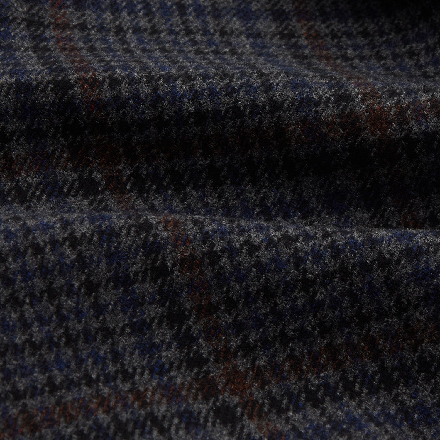 View 4 of product The Turnbull & Asser Charcoal Grey Check Wool Pierce Gown features a long, gown-style silhouette with a shawl collar, wrap-around belt, cuffed sleeves, and white edge stitching, shown against a plain white background.