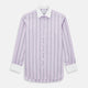 The Turnbull & Asser Lilac Track Stripe Shirt with Contrast T&A Collar and Cuffs features vertical black stripes, a white pointed collar, and white cuffs, shown flat against a white background.
