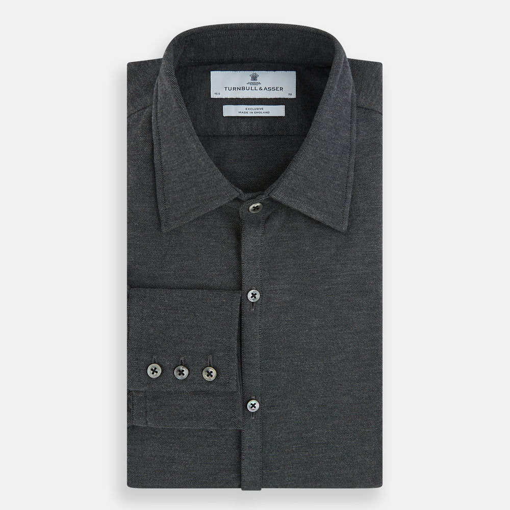 The Charcoal Melange Westminster Shirt by Turnbull & Asser features a long-sleeve, button-up design with a Turnbull collar and buttoned cuffs, offering classic British craftsmanship in a timeless style.