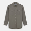 View 1 of product The Turnbull & Asser Dusty Sage Cotton Drill Weekend Fit Nevis Shirt features a button-down collar, long sleeves, two chest pockets, and white buttons, shown folded on a white background.