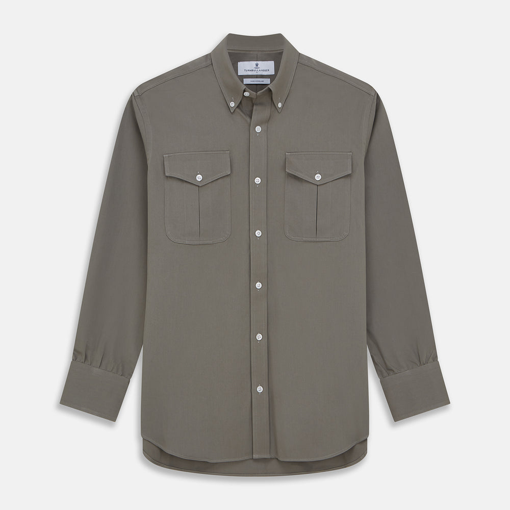 The Turnbull & Asser Dusty Sage Cotton Drill Weekend Fit Nevis Shirt features a button-down collar, long sleeves, two chest pockets, and white buttons, shown folded on a white background.