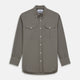 The Turnbull & Asser Dusty Sage Cotton Drill Weekend Fit Nevis Shirt features a button-down collar, long sleeves, two chest pockets, and white buttons, shown folded on a white background.