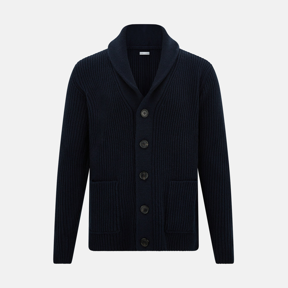 The Turnbull & Asser Midnight Blue Cashmere Shawl Collar Cardigan features ribbed fabric, five black front buttons, a shawl collar, and two front patch pockets, shown against a plain light background.