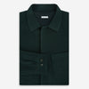 View 5 of product The Forest Green Greenwich Knitted Overshirt by Turnbull & Asser, crafted from Italian wool, features long sleeves, a collar, front buttons, and two chest pockets—one flap, one open—shown on a white background.