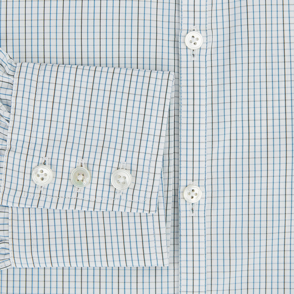 The Pale Blue and Navy Grid Check Westminster Shirt by Turnbull & Asser features a button-down front and pointed collar, highlighting fine British craftsmanship, displayed on a white background.