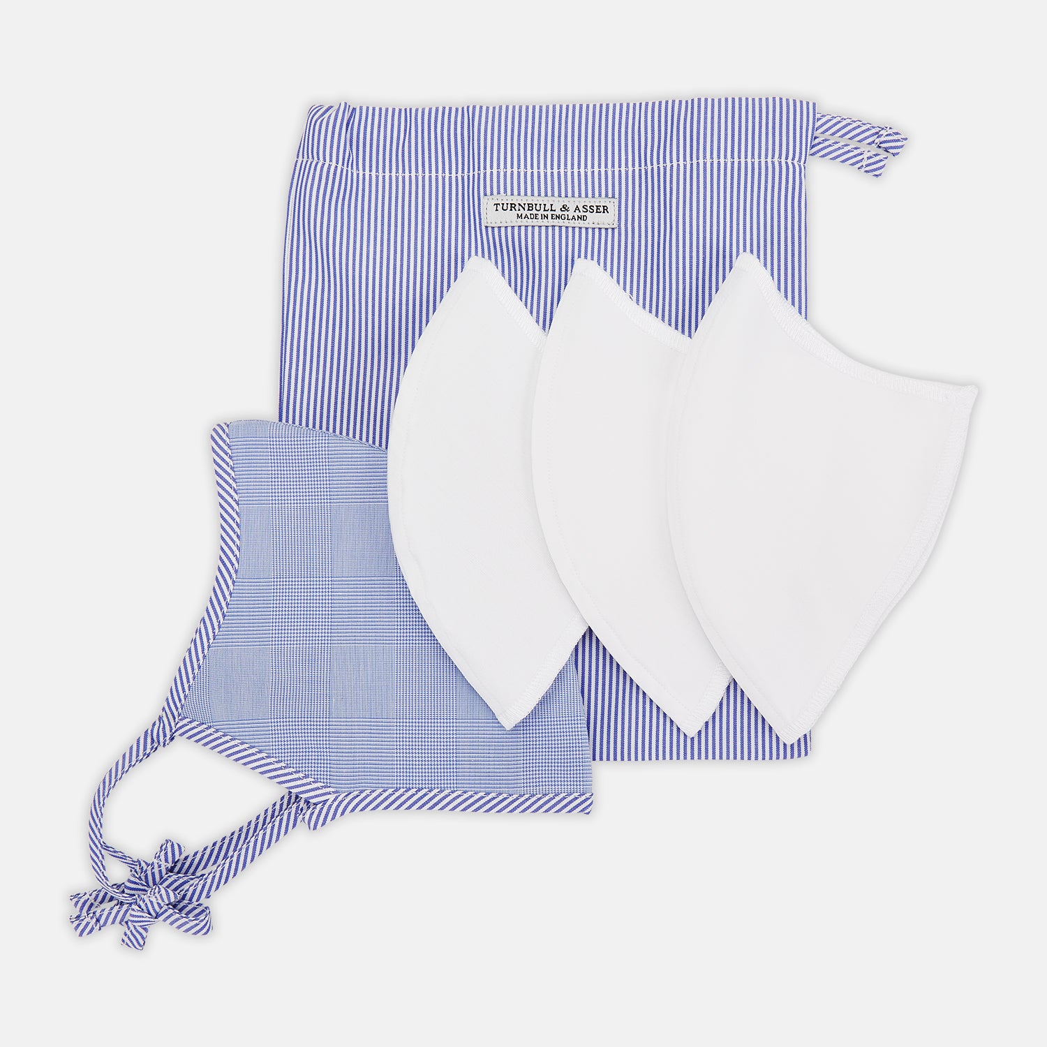 View 6 of product The Turnbull & Asser Blue Fine Check Zephyr Cotton Commuter Mask features a light blue and white check pattern, adjustable side ties, and comes with 3 Viroformula™ filters. Shown on a plain white background.