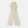 View 1 of product The Turnbull & Asser White Cashmere Scarf features a soft, cream-colored lightweight texture and fringed edges, elegantly displayed on a white background—ideal for adding sophistication to eveningwear.