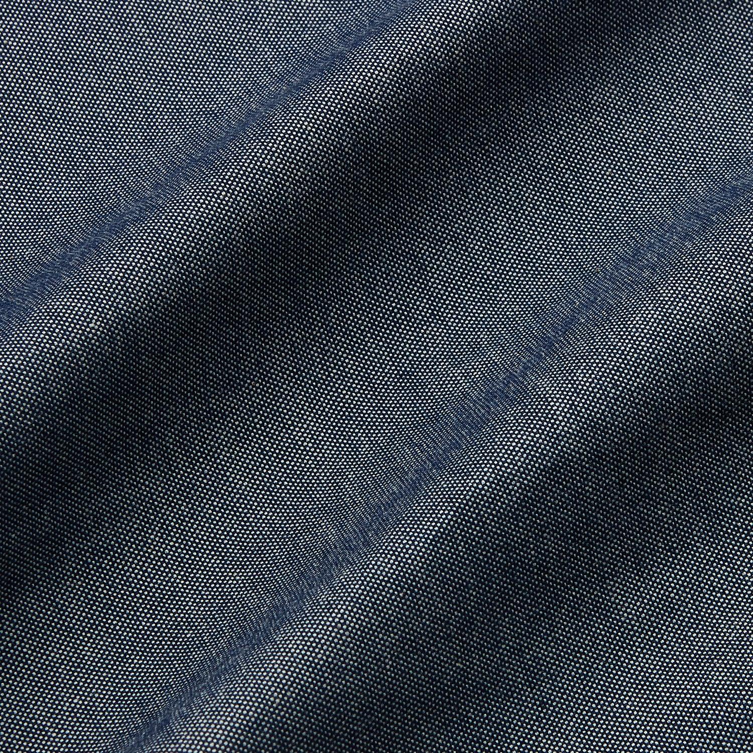 View 4 of product The Turnbull & Asser Plain Blue Oxford Cotton Weekend Fit Blake Shirt features long sleeves, a stand collar, and white buttons, displayed flat on a white background.