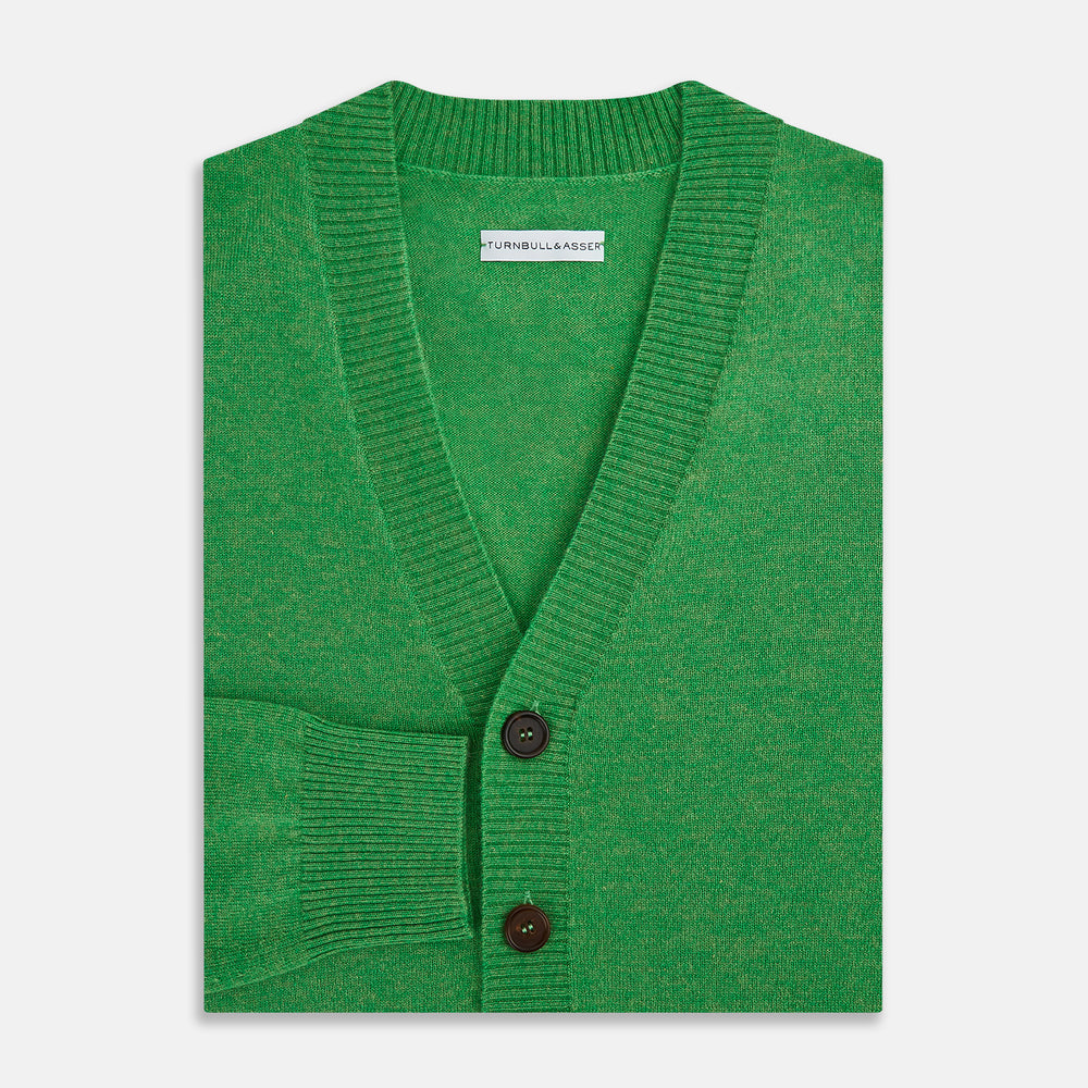 The Turnbull & Asser Lime Green Cashmere Cardigan features a V-neck, long sleeves, ribbed cuffs and hem, button-down front, and two front pockets—an essential knitwear piece shown against a plain white background.