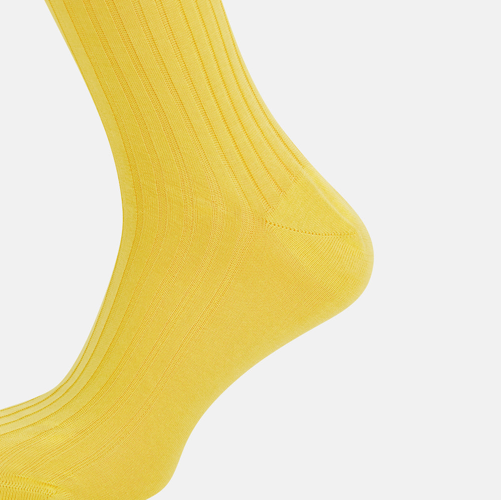 A single Charteuese Lemon Mid-Length Sock by Turnbull & Asser, knee-high and bright yellow with a ribbed Egyptian cotton texture, is displayed upright against a plain white background.