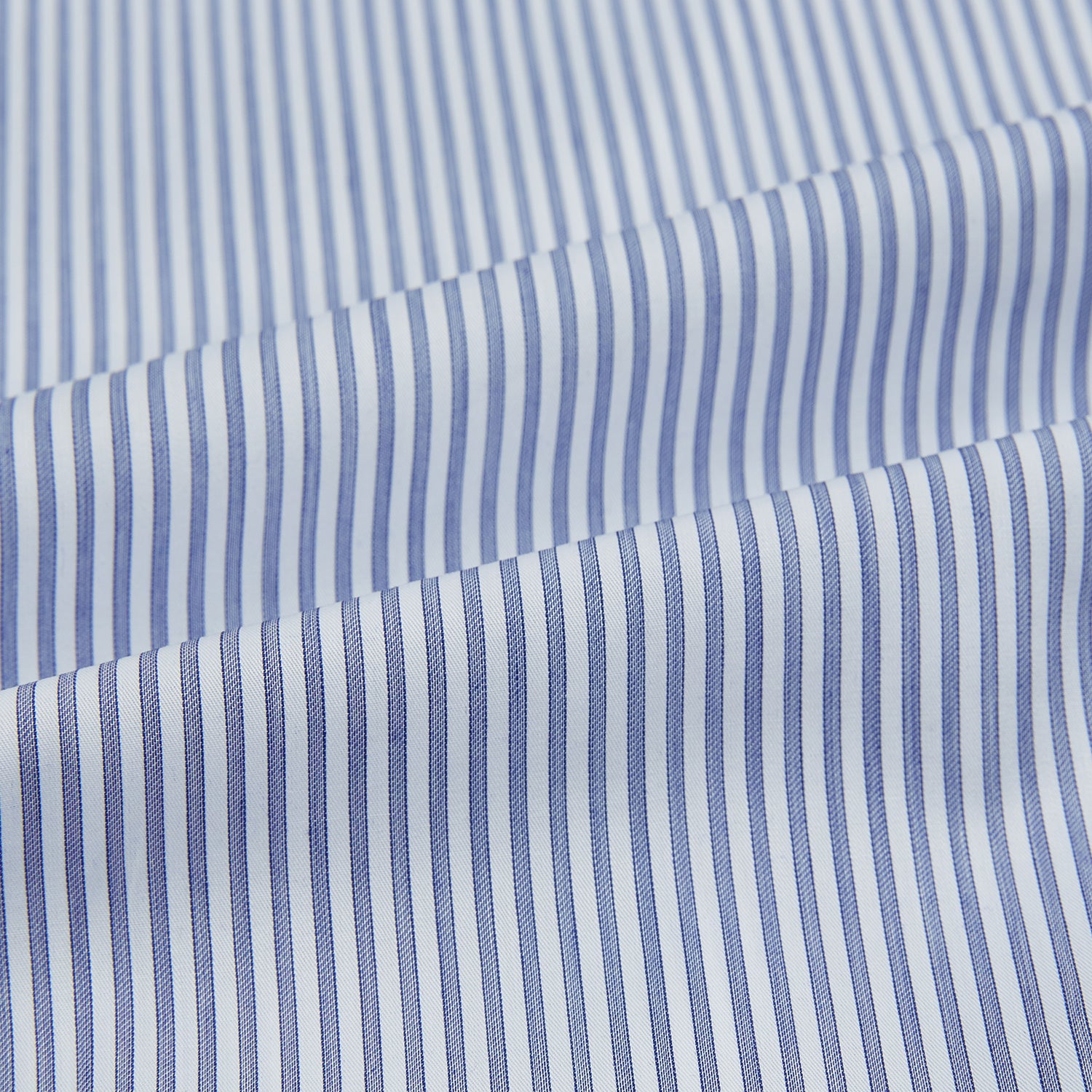 View 8 of product The Turnbull & Asser Navy and White Stripe Westminster Shirt features thin vertical stripes, a Turnbull collar, long sleeves, and classic British craftsmanship, shown flat on a white background.