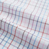 View 6 of product The Turnbull & Asser Pink Multi Double Grid Check Mayfair Shirt, made from organic cotton with a pointed collar and buttoned cuffs, features a light pink base with blue and red grid checks and is shown flat on a white background.