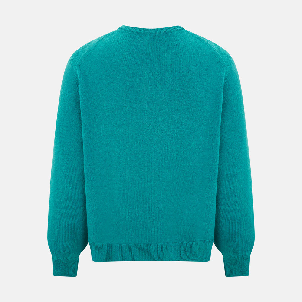 The Turnbull & Asser Turquoise Cashmere V-neck Jumper features long sleeves with ribbed cuffs and hem, displayed on a plain white background—a chic knitwear addition.