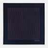 View 4 of product A navy silk pocket square with thin, even purple stripes and hand-rolled edges from Turnbull & Asser, featuring "Turnbull & Asser Hand Printed in England" printed in the corner.