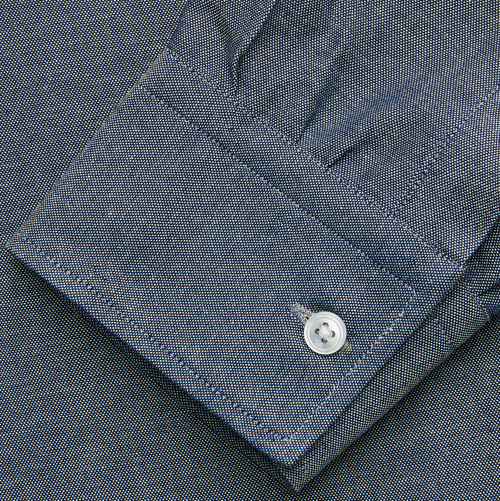 The Turnbull & Asser Blue Weekend Fit Oxford Finch Shirt features a Derby collar, chest pocket, white buttons, and classic fit—part of the Weekend Fit shirts collection—laid flat on a white background.