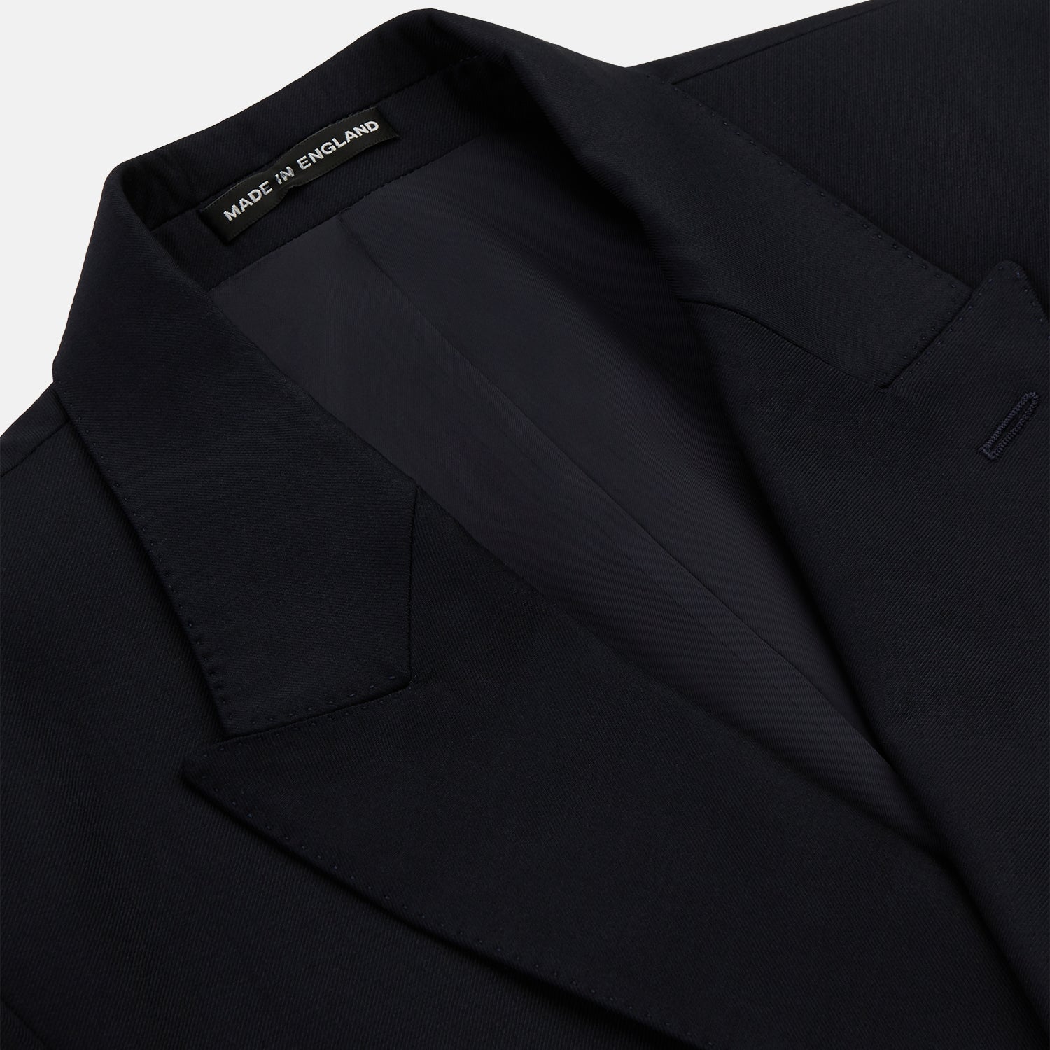 View 2 of product The Turnbull & Asser Navy Plain Wool Double Breasted Blazer features a nautical-inspired design with gold buttons, peaked lapels, and flap pockets, shown against a white background.