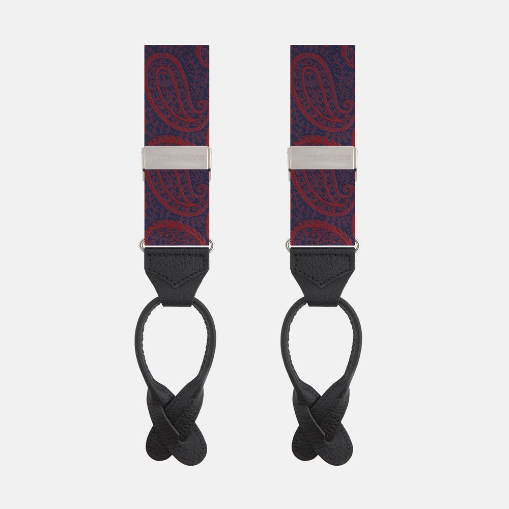 Two Red Jacquard Silk Paisley Braces by Turnbull & Asser, featuring black leather ends and silver-tone buckles, are displayed side by side on a plain white background.