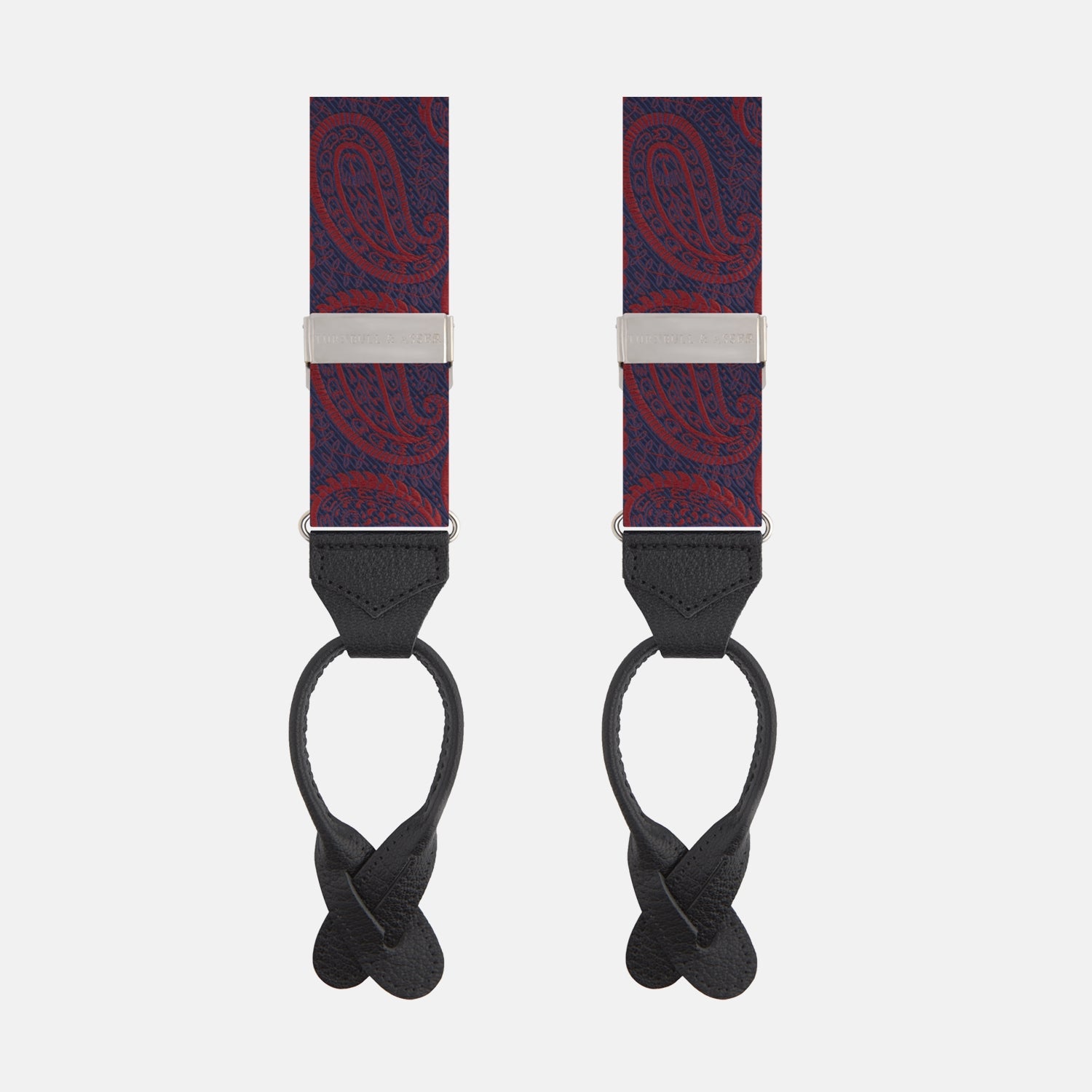 View 1 of product Two Red Jacquard Silk Paisley Braces by Turnbull & Asser, featuring black leather ends and silver-tone buckles, are displayed side by side on a plain white background.