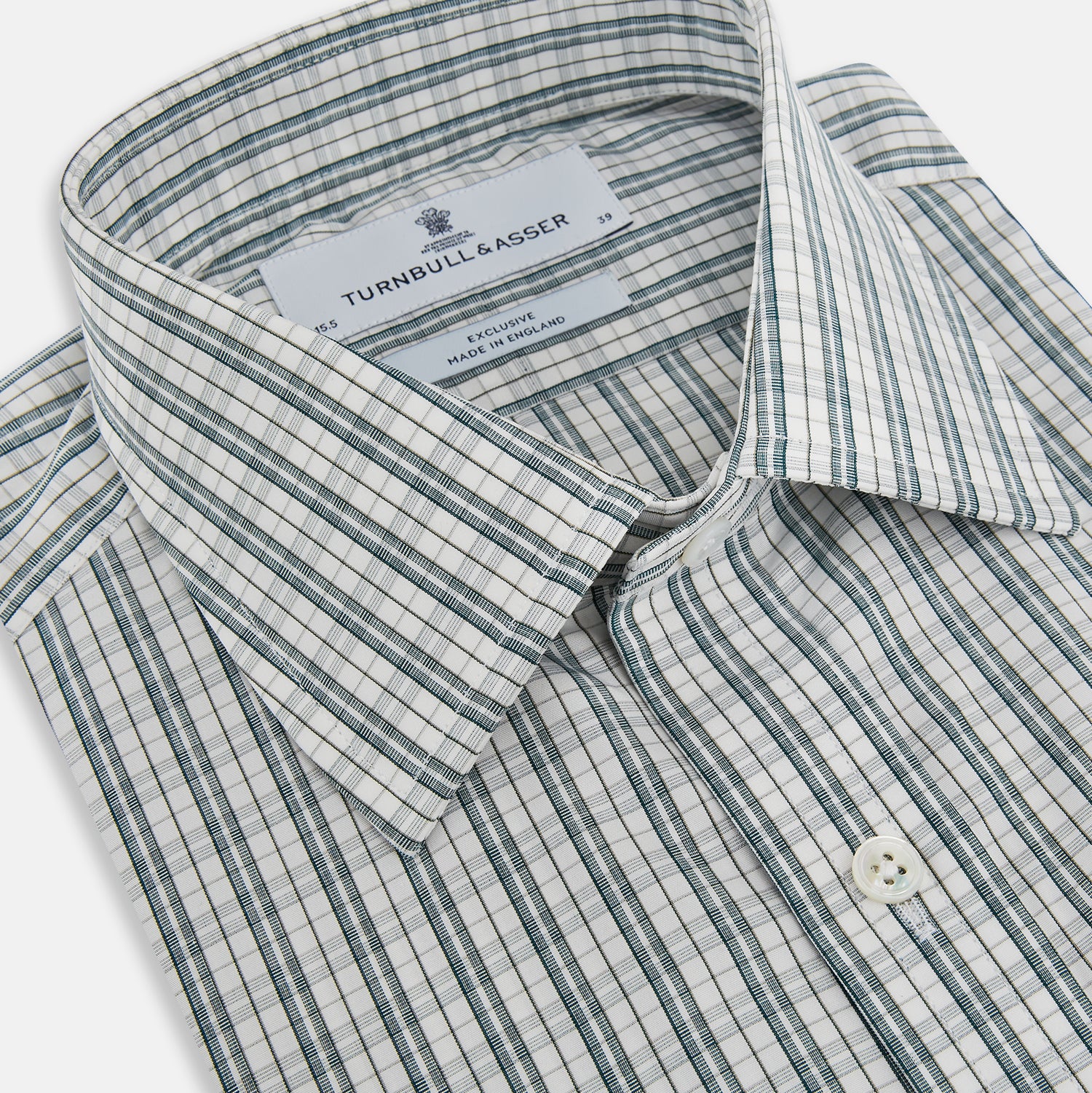 View 2 of product The Turnbull & Asser Forest Green Multi Check Mayfair Shirt is a long-sleeve button-up crafted from premium Italian cotton, featuring a blue and forest green check on white, with a pointed collar and buttoned cuffs.