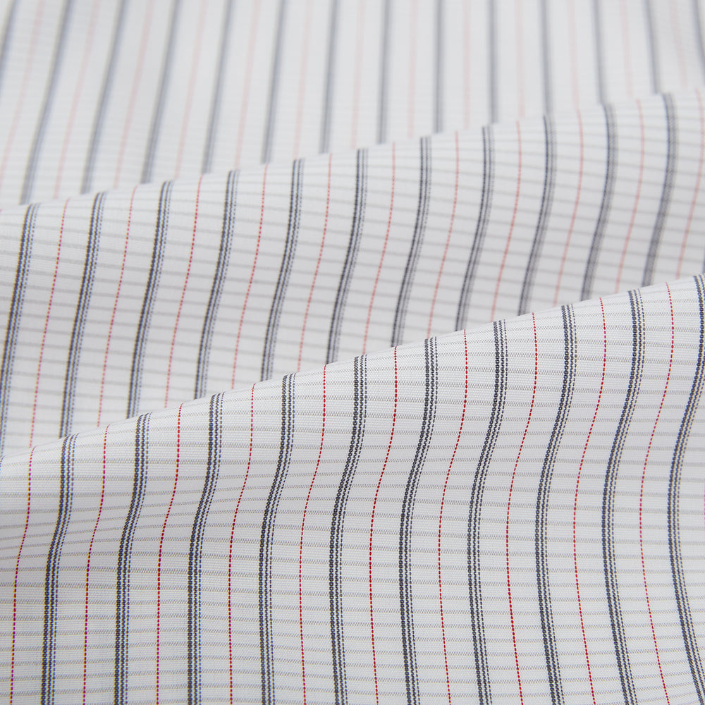 A red and navy graph check Westminster shirt by Turnbull & Asser with a formal collar and tailored fit, featuring a button-up front and buttoned cuffs, laid flat on a white background.