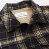 View 2 of product The Turnbull & Asser Navy and Beige Check Wool and Mohair Blend Somerset Overshirt, featuring long sleeves, two chest pockets, and a classic collar, is laid flat on a white background.